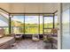 Relaxing screened patio featuring outdoor furniture and views of the lush landscape at 1229 Saddleback Ridge Rd, Apopka, FL 32703