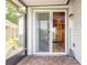 Screened patio with a tile floor leading into a kitchen with stainless steel appliances at 1229 Saddleback Ridge Rd, Apopka, FL 32703