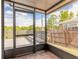 Inviting screened patio featuring a wooden bench and peaceful surroundings at 1229 Saddleback Ridge Rd, Apopka, FL 32703