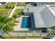 Aerial view of a beautiful home with a private pool, a spacious layout, and a well-maintained yard, fenced for privacy at 1317 Suwanee Rd, Daytona Beach, FL 32114
