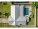 Drone image of a home showcasing a private pool with a patio and modern metal roof at 1317 Suwanee Rd, Daytona Beach, FL 32114