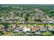 Aerial view of a residential neighborhood featuring single-Gathering homes and tree-lined streets at 1317 Suwanee Rd, Daytona Beach, FL 32114