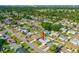 Aerial shot shows the property nestled in a neighborhood with lush greenery and waterway in distance at 1317 Suwanee Rd, Daytona Beach, FL 32114