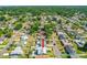Aerial view shows property with a pool is nestled in a residential neighborhood with tree-lined streets at 1317 Suwanee Rd, Daytona Beach, FL 32114
