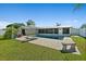 Backyard features a refreshing pool with patio, and a well-maintained lawn, offering a private outdoor retreat at 1317 Suwanee Rd, Daytona Beach, FL 32114