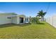 Lawn in the backyard offers a verdant area for outdoor activities, enhancing the property's appeal at 1317 Suwanee Rd, Daytona Beach, FL 32114