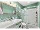 Bright bathroom with a shower-tub combo and modern vanity at 1317 Suwanee Rd, Daytona Beach, FL 32114