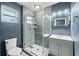 Modern bathroom features a glass-enclosed shower and stylish gray vanity at 1317 Suwanee Rd, Daytona Beach, FL 32114