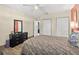 Bedroom featuring neutral walls and wood-look tile floors at 1317 Suwanee Rd, Daytona Beach, FL 32114