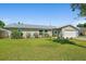 Charming single-story home featuring a well-manicured lawn and updated metal roof in a desirable neighborhood at 1317 Suwanee Rd, Daytona Beach, FL 32114