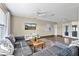 Open living room with a large window view and modern furnishings, seamlessly connecting to the outdoors at 1317 Suwanee Rd, Daytona Beach, FL 32114