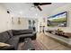 Comfortable living room features tile flooring and a ceiling fan at 1317 Suwanee Rd, Daytona Beach, FL 32114
