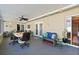 Spacious screened-in patio with a fan and comfortable seating, ideal for entertaining guests and lounging at 1317 Suwanee Rd, Daytona Beach, FL 32114