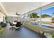 Enclosed patio provides seamless views of the outdoor pool and patio area at 1317 Suwanee Rd, Daytona Beach, FL 32114