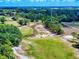 Aerial view of golf course, highlighting the manicured greens and scenic surroundings at 1371 Merrifield Ct, Deltona, FL 32725