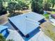 Aerial view of a single-Gathering home, showcasing its roof, driveway, and landscaping at 1371 Merrifield Ct, Deltona, FL 32725