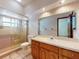 Bathroom with updated vanity, shower stall and window at 1371 Merrifield Ct, Deltona, FL 32725