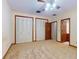 Bedroom with closet, ceiling fan and attached bath at 1371 Merrifield Ct, Deltona, FL 32725