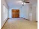 Bedroom with carpet, closet, ceiling fan, and good natural light at 1371 Merrifield Ct, Deltona, FL 32725