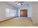 Bedroom features neutral carpet, ceiling fan, closet and a double door closet at 1371 Merrifield Ct, Deltona, FL 32725