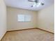 Bedroom features neutral carpet, and a window for natural light at 1371 Merrifield Ct, Deltona, FL 32725