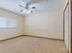Bedroom boasts neutral carpet and a ceiling fan with integrated lighting at 1371 Merrifield Ct, Deltona, FL 32725