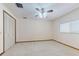 Bedroom with neutral carpet, ceiling fan, closet, and a bright window at 1371 Merrifield Ct, Deltona, FL 32725