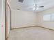 Bedroom with built-in closet space, neutral carpet, ceiling fan, and a bright window at 1371 Merrifield Ct, Deltona, FL 32725