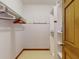 Walk-in closet with built-in shelving and hanging rods for organization at 1371 Merrifield Ct, Deltona, FL 32725