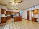 Well-lit kitchen featuring stainless steel appliances, an island, and a serving desk at 1371 Merrifield Ct, Deltona, FL 32725