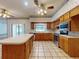 Kitchen area with a breakfast bar, lots of cabinets and modern stainless steel appliances at 1371 Merrifield Ct, Deltona, FL 32725