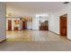 Open-concept living space with a kitchen and a dining area boasting abundant natural light at 1371 Merrifield Ct, Deltona, FL 32725
