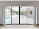 View of the screened-in patio through sliding glass doors, offering an outdoor living space at 1371 Merrifield Ct, Deltona, FL 32725