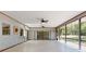 Sunroom with skylights, tile floor, ceiling fans and screened windows with backyard views at 1371 Merrifield Ct, Deltona, FL 32725