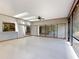 Bright sunroom featuring tiled flooring, skylights, fan, and sliding doors at 1371 Merrifield Ct, Deltona, FL 32725