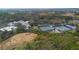 Beautiful aerial view of tennis courts, community pool, parking and common areas surrounded by lush landscaping at 1374 Red Clover Ln, Deland, FL 32724