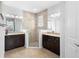 Bright bathroom features double vanities, granite countertops, and a glass-enclosed shower at 1374 Red Clover Ln, Deland, FL 32724