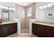 Bathroom featuring dual vanities, tiled floors, and a glass enclosed shower at 1374 Red Clover Ln, Deland, FL 32724