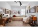 Cozy bedroom with comfortable daybed, writing desk, and natural light at 1374 Red Clover Ln, Deland, FL 32724
