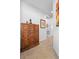 Hallway featuring a decorative cabinet with multiple small drawers and a tiled floor at 1374 Red Clover Ln, Deland, FL 32724