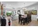Open-concept living area with tile floors, and large sliding glass doors leading to a private lanai at 1374 Red Clover Ln, Deland, FL 32724
