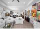 Spacious living room featuring an open floor plan with contemporary decor and easy access to the kitchen and dining area at 1374 Red Clover Ln, Deland, FL 32724