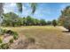 Large grassy backyard with plenty of space and mature trees creating a private feel at 1420 Shady Meadow Ln, Deland, FL 32724