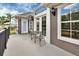 Spacious balcony with outdoor seating, neutral-toned exterior and decorative outdoor lighting at 1420 Shady Meadow Ln, Deland, FL 32724