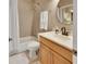 Bathroom featuring a tub, shower, and vanity with a mirror, combining style and functionality at 1420 Shady Meadow Ln, Deland, FL 32724