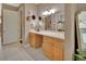 Bathroom vanity area with dual sinks, a large mirror, and plenty of natural light at 1420 Shady Meadow Ln, Deland, FL 32724
