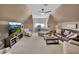 Large bonus room with a ceiling fan, comfortable seating, and a media center for relaxation at 1420 Shady Meadow Ln, Deland, FL 32724