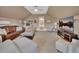 Bright bonus room featuring multiple seating areas and a media setup for diverse entertainment at 1420 Shady Meadow Ln, Deland, FL 32724