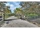 Gated entrance to the property provides privacy and security on this estate at 1420 Shady Meadow Ln, Deland, FL 32724