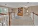 Hallway featuring a bookcase, natural lighting, and view of the home's interior at 1420 Shady Meadow Ln, Deland, FL 32724